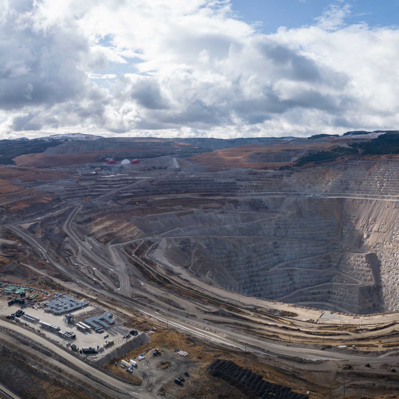 Large open mine with roads and terraced excavation