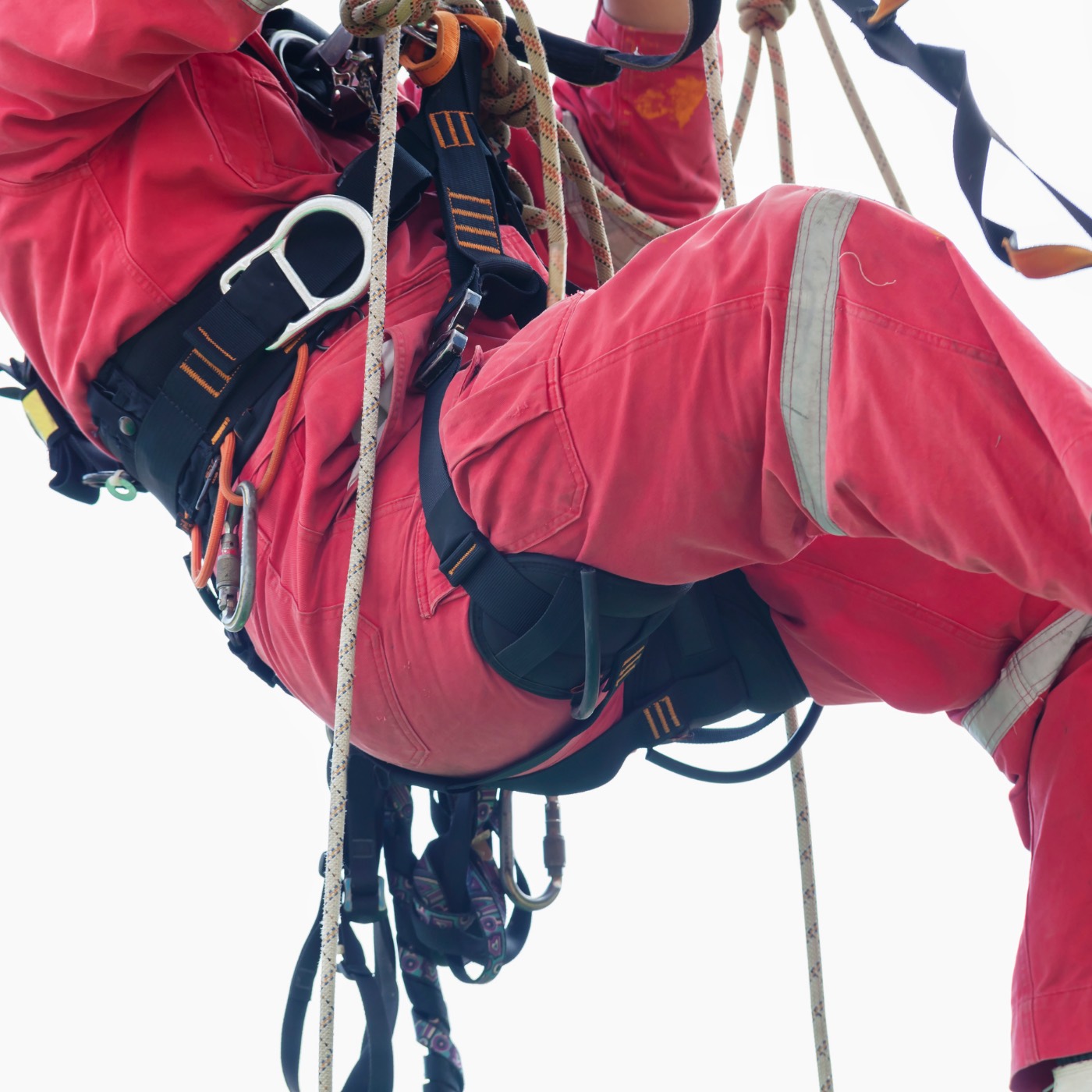 Close-up of rope access harness and ropes on a technician